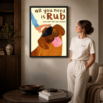 all you need rub canvas art in a black frame beside a woman and round wooden table.