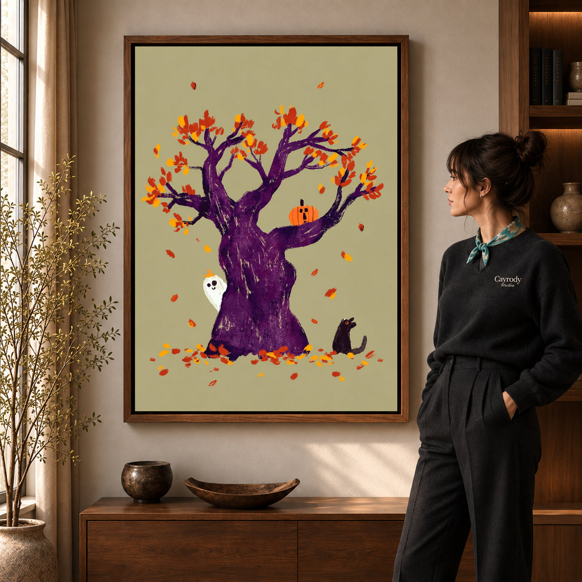 autumn ghost tree canvas art shown in the walnut frame option within a warm living room.