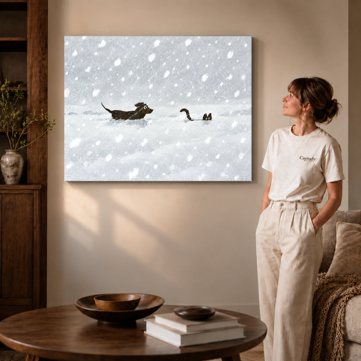 snow chase companions canvas art on gallery-wrapped canvas with visible edge depth beside a standing woman.