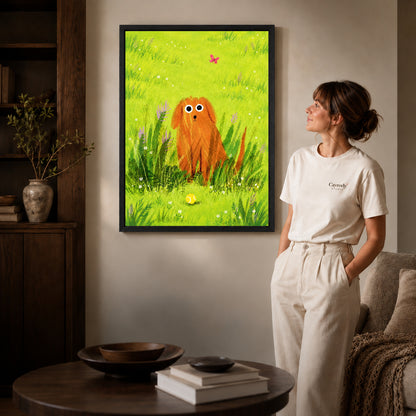 dog meadow daydream canvas art in a black frame beside a woman and round wooden table.