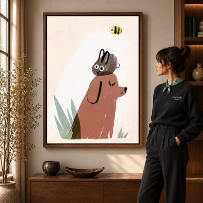 dog rabbit daydream canvas art in a walnut frame beside a standing woman and wooden console.