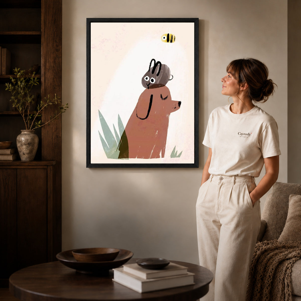 dog rabbit daydream canvas art shown in the black frame option against a softly lit wall.