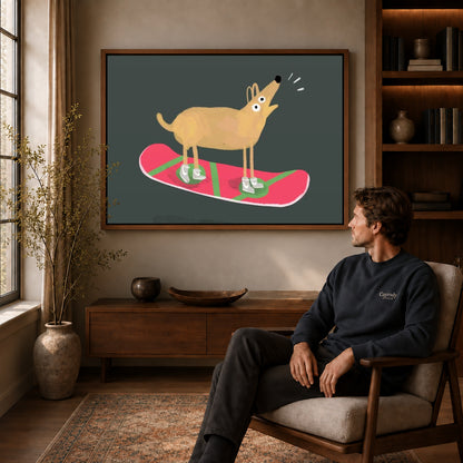 snowboard dog adventure canvas art in a walnut frame above a console beside a seated man.