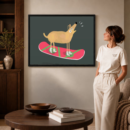 snowboard dog adventure canvas art in a black frame beside a woman and round wooden table.