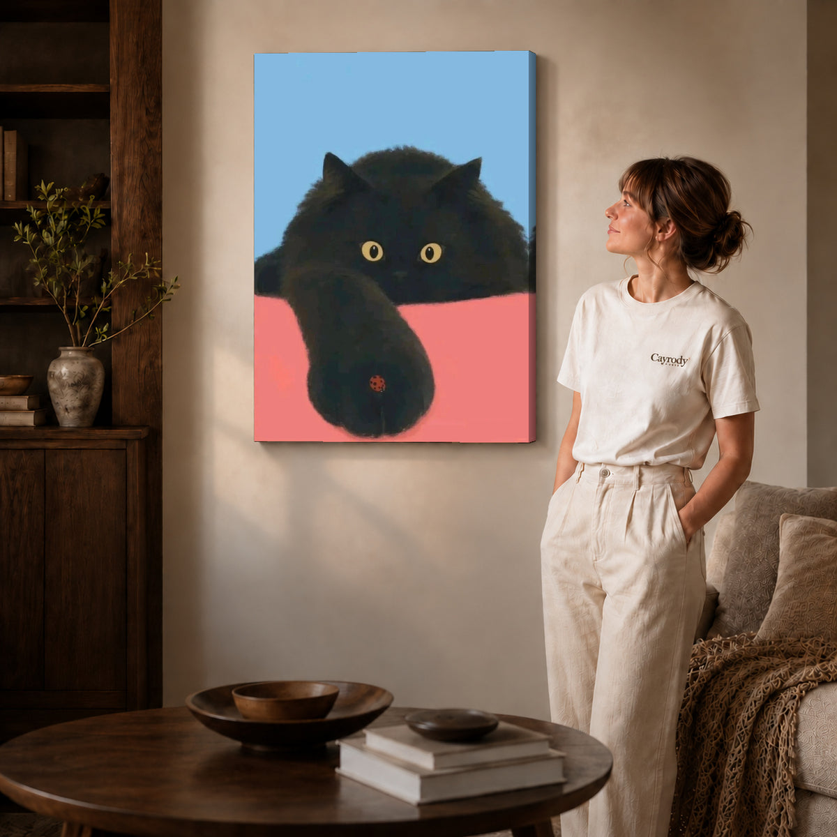 ladybug paw pause canvas art on gallery-wrapped canvas with natural edge shading beside a standing woman.