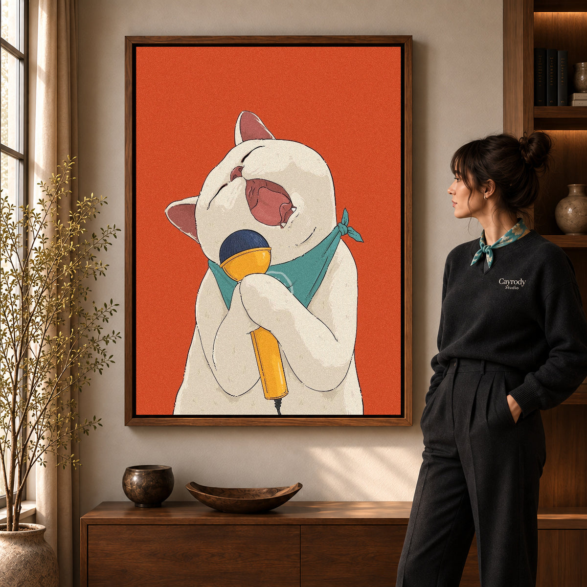 singing cat serenade canvas art in a walnut frame beside a standing woman and wooden console.
