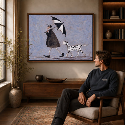 umbrella walk companions canvas art in a walnut frame above a console beside a seated man.