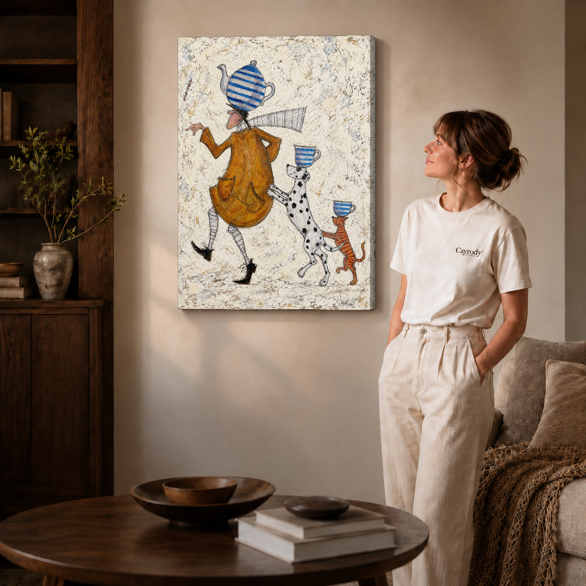 teacup walking parade canvas art on gallery-wrapped canvas with natural edge shading beside a standing woman.