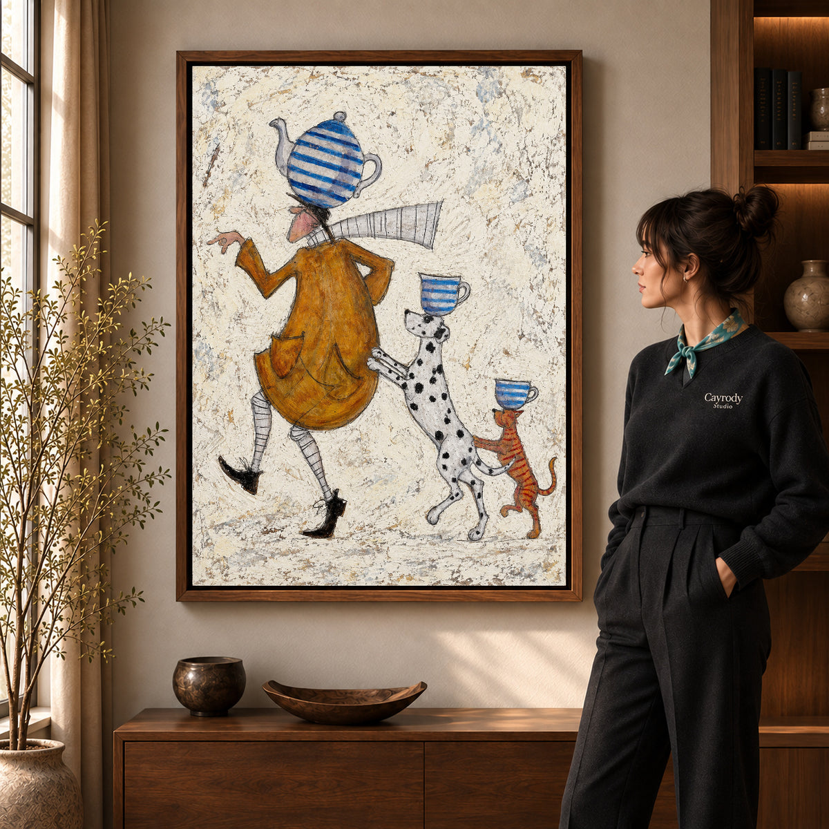 teacup walking parade canvas art shown in the walnut frame option within a warm living room.