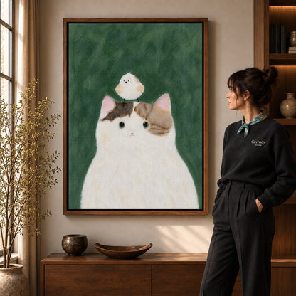 cat bird gentle friendship canvas art shown in the walnut frame option within a warm living room.