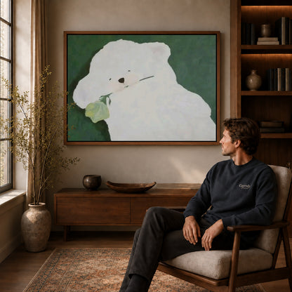 rose bearing puppy canvas art in a walnut frame above a console beside a seated man.
