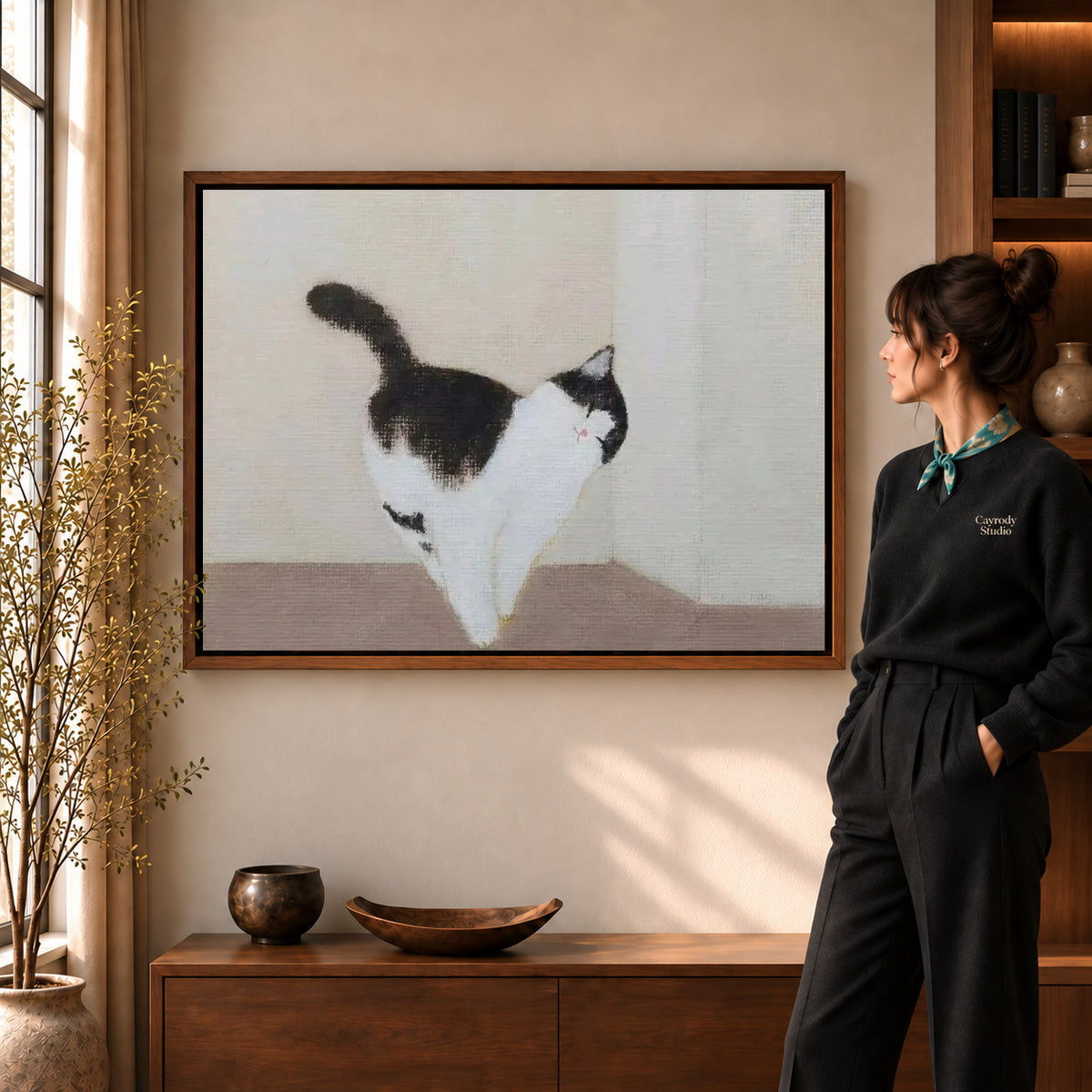 quiet cat stroll canvas art shown in the walnut frame option within a warm living room.
