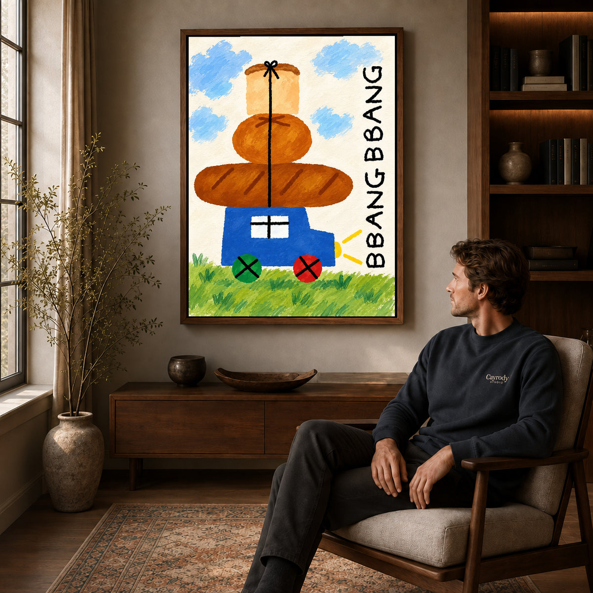 bread cart parade canvas art in a walnut frame above a console beside a seated man.