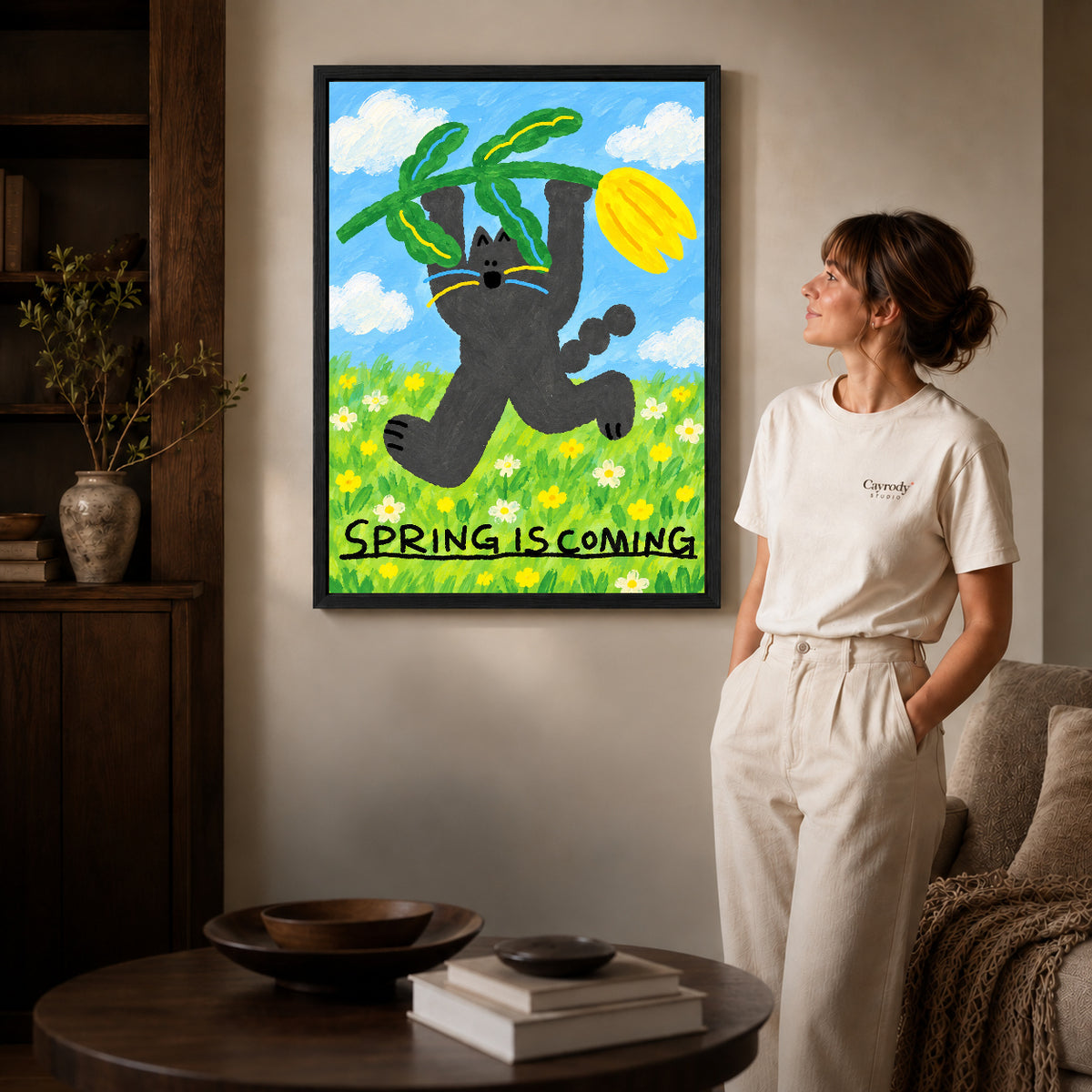 spring tulip cat canvas art shown in the black frame option against a softly lit wall.