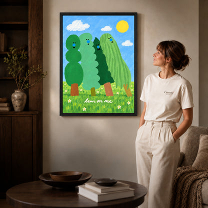 lean on me trees canvas art shown in the black frame option against a softly lit wall.