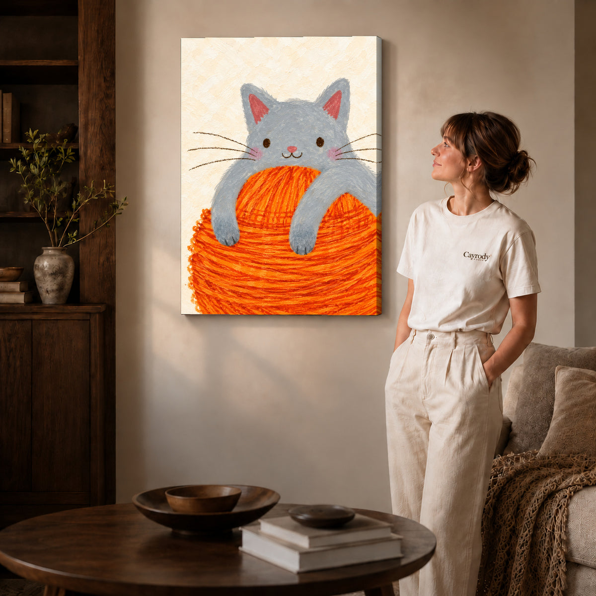 kitten yarn hug canvas art shown in the gallery-wrapped option with visible depth and warm surroundings.
