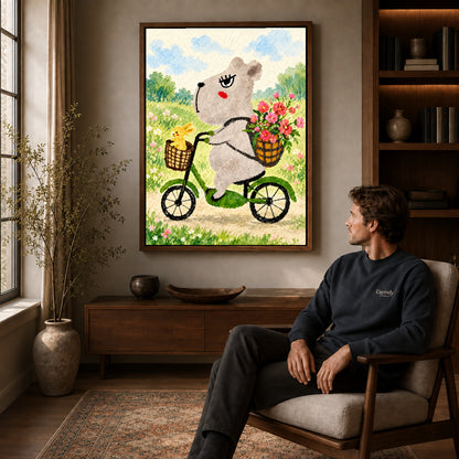 capybara bicycle ride canvas art in a walnut frame above a console beside a seated man.