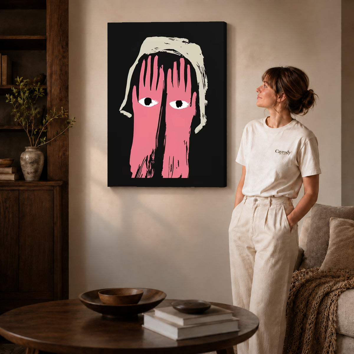 pink hands watch canvas art on gallery-wrapped canvas with natural edge shading beside a standing woman.