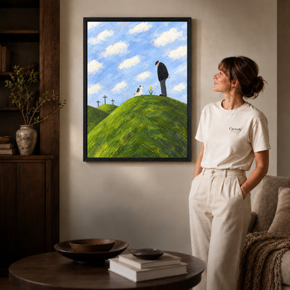 hilltop remembrance canvas art in a black frame beside a woman and round wooden table.