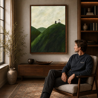 hilltop quiet company canvas art in a walnut frame above a console beside a seated man.