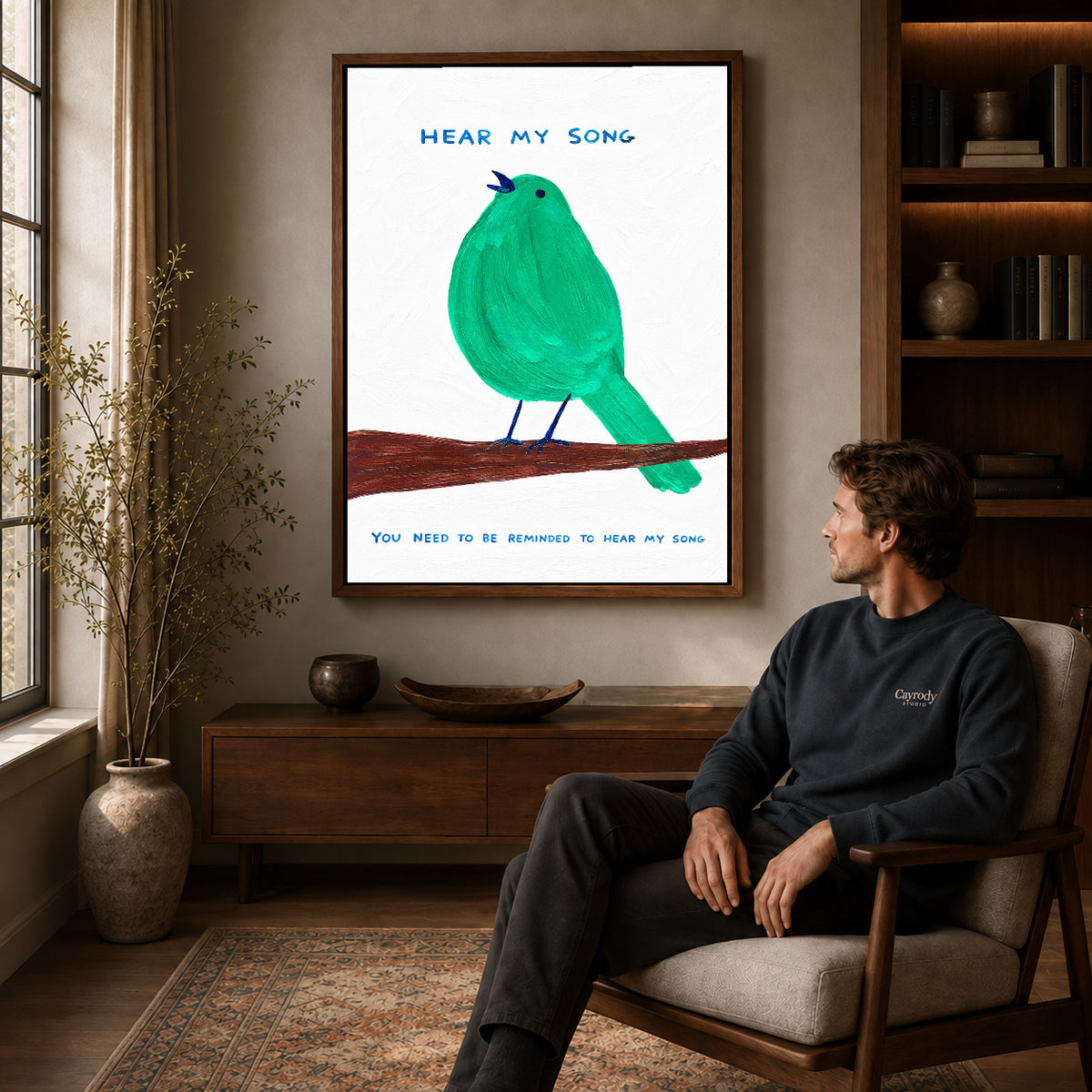 hear my song canvas art in a walnut frame above a console beside a seated man.