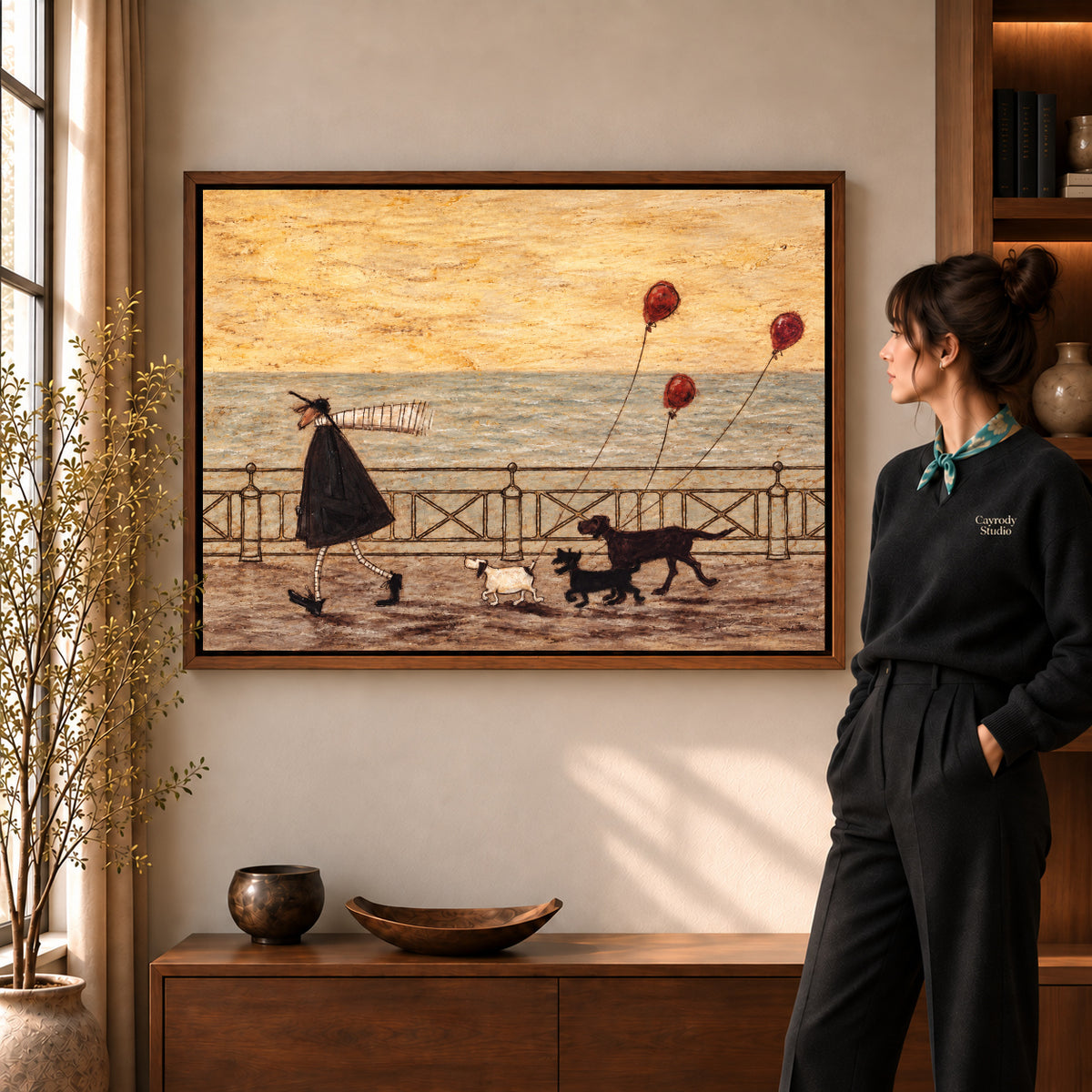 seaside dog walk canvas art shown in the walnut frame option within a warm living room.
