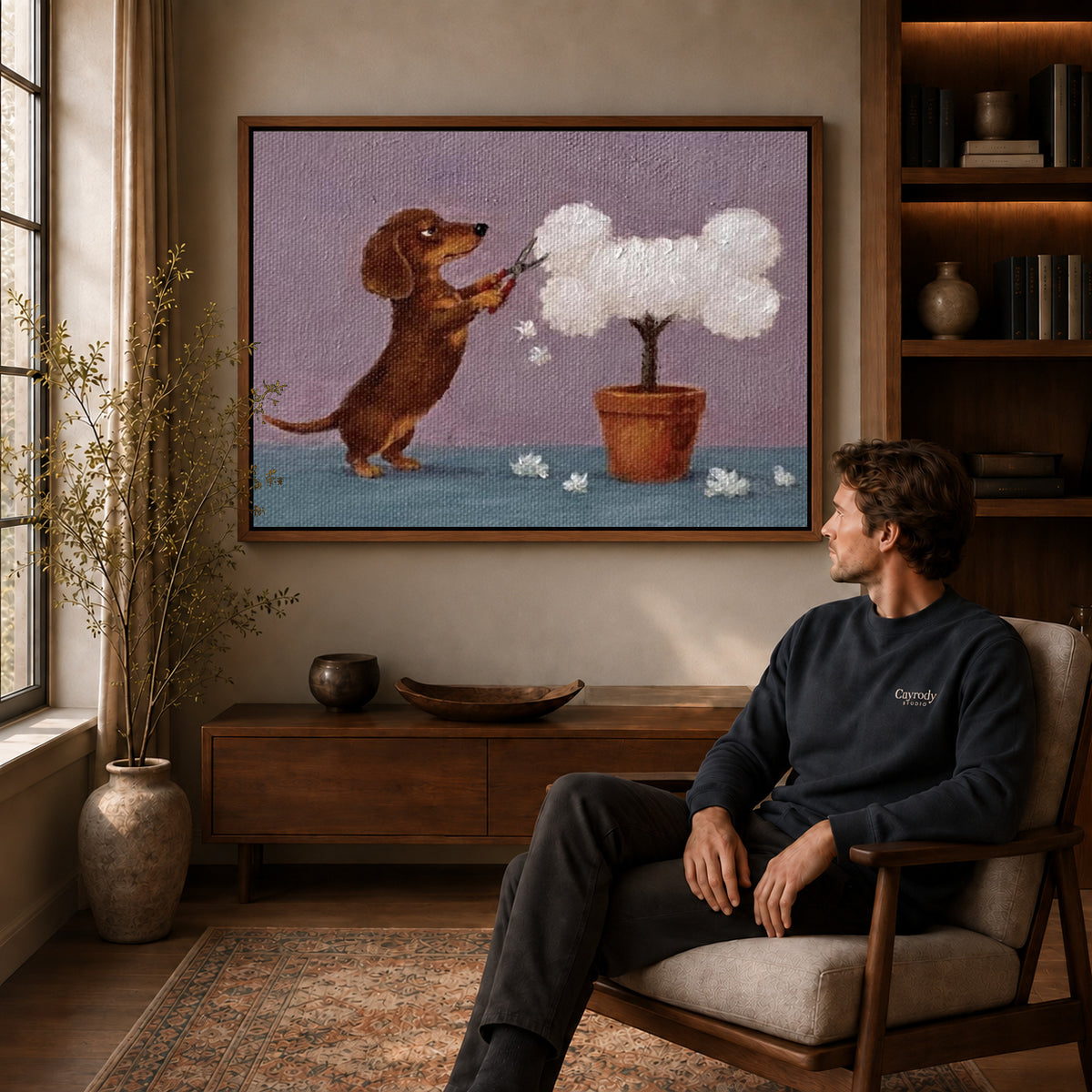 Walnut framed gardening dachshund canvas art displayed above a seated man in a wood furnished room.