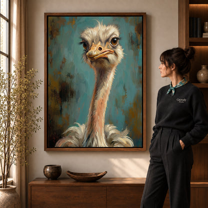 Expressive ostrich portrait canvas art in a walnut frame beside a standing woman in a warm living room.