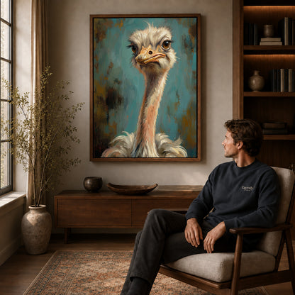 Walnut framed expressive ostrich portrait canvas art displayed above a seated man in a wood furnished room.