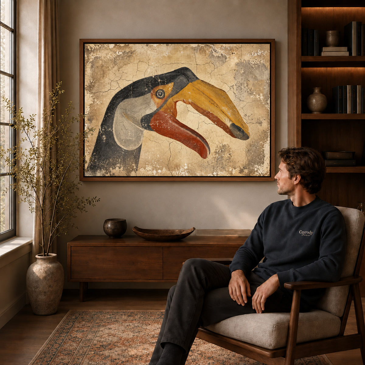 Walnut framed rustic toucan artwork above a seated man in a wood furnished living room.