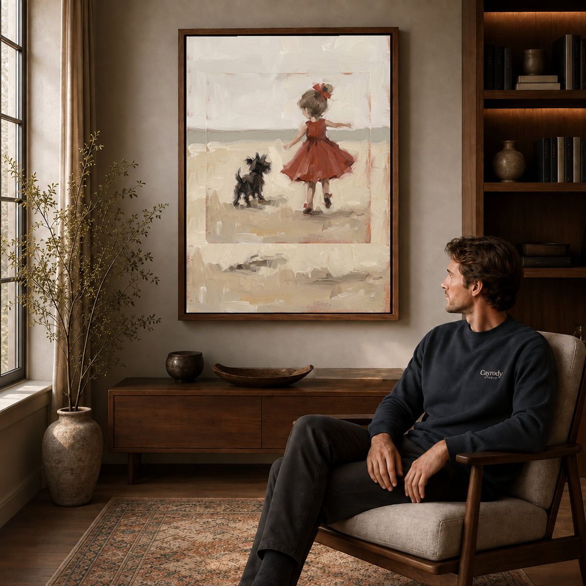 Walnut framed girl and dog canvas art displayed above a seated man in a wood furnished living room.
