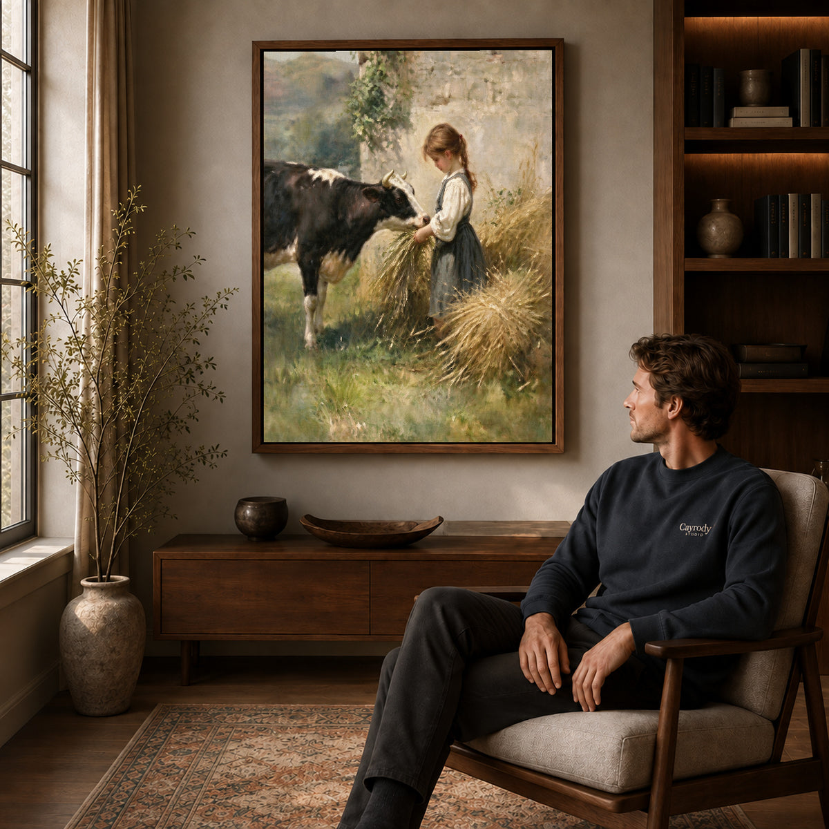 Walnut framed girl feeding cow canvas art displayed above a seated man in a wood furnished living room.