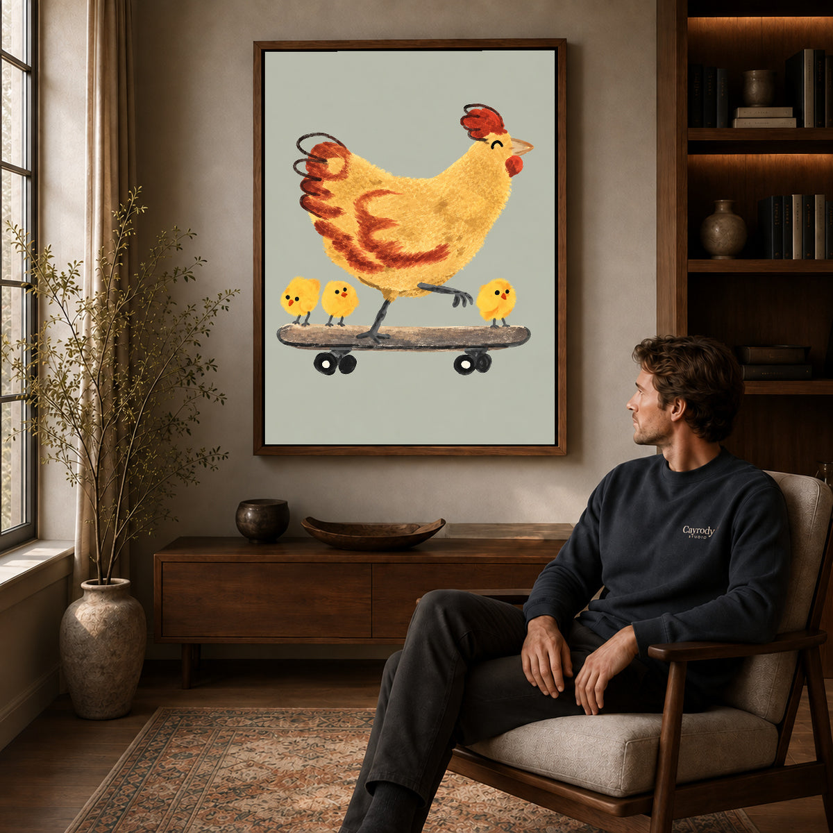 Walnut framed skateboard chicken canvas art displayed above a seated man in a wood furnished room.