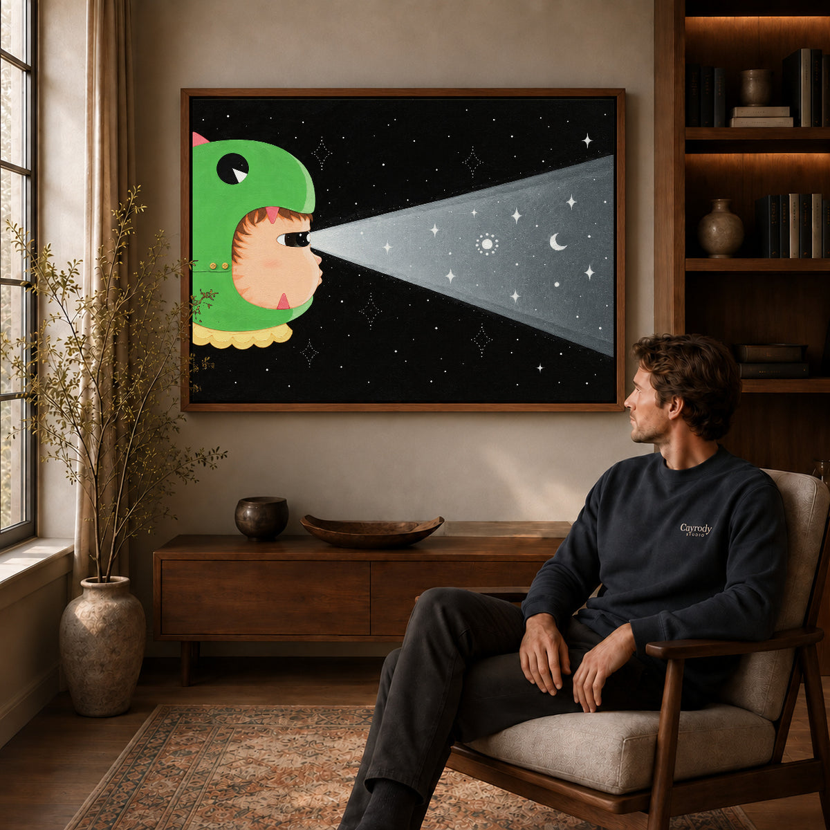 Walnut framed dinosaur hood cat artwork above a seated man in a wood furnished living room.