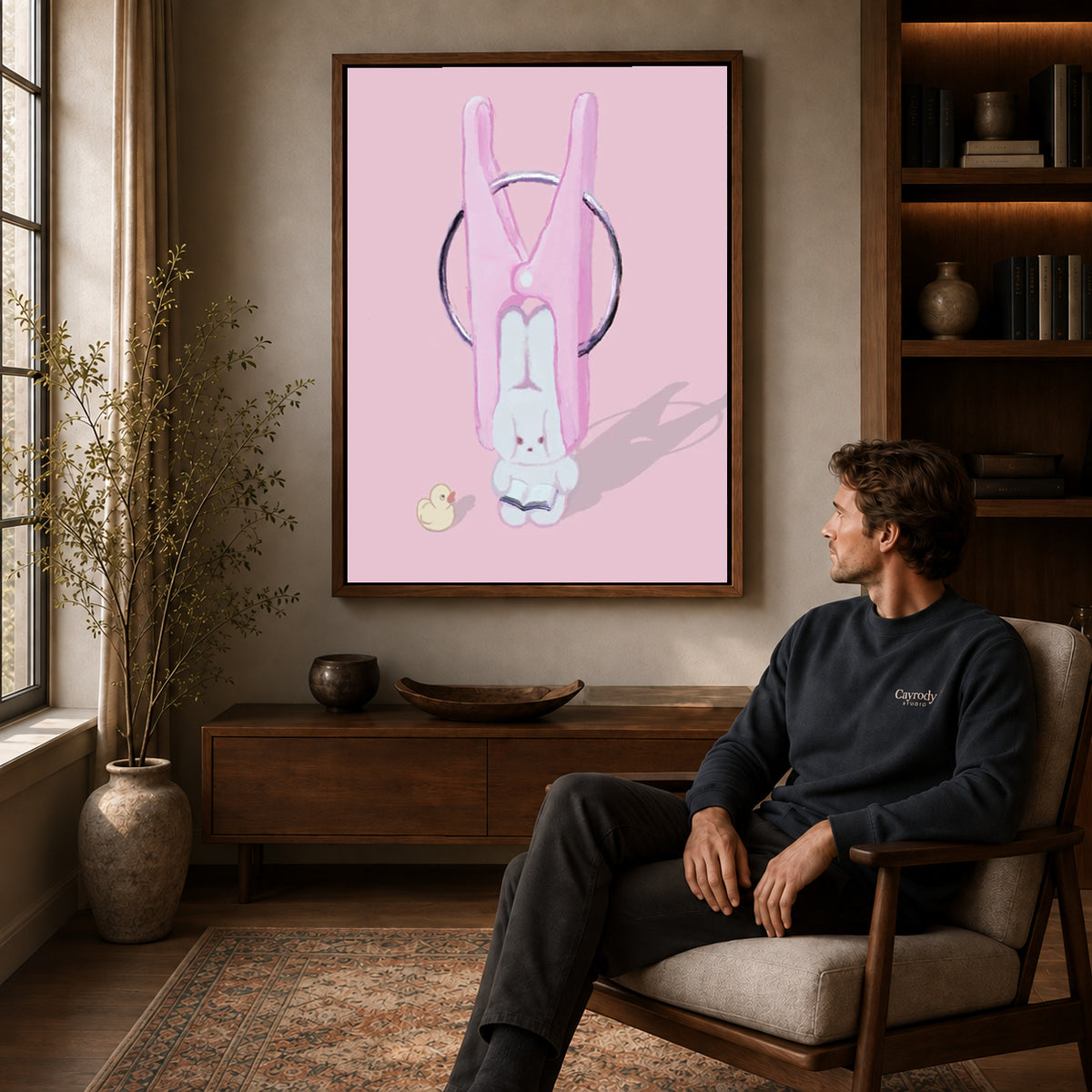 Walnut framed bunny clothespin canvas art displayed above a seated man in a wood furnished living room.
