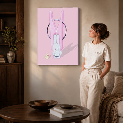 Gallery wrapped bunny clothespin canvas art with naturally shaded canvas edges beside a woman wearing cream clothing.