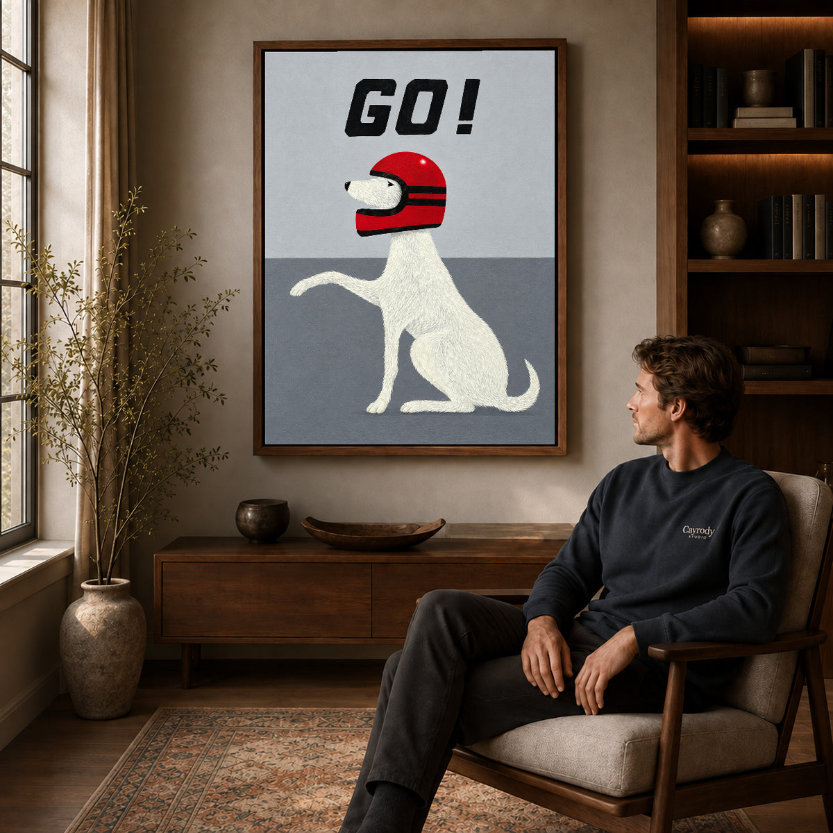 Walnut framed playful helmet dog artwork above a seated man in a wood furnished living room.