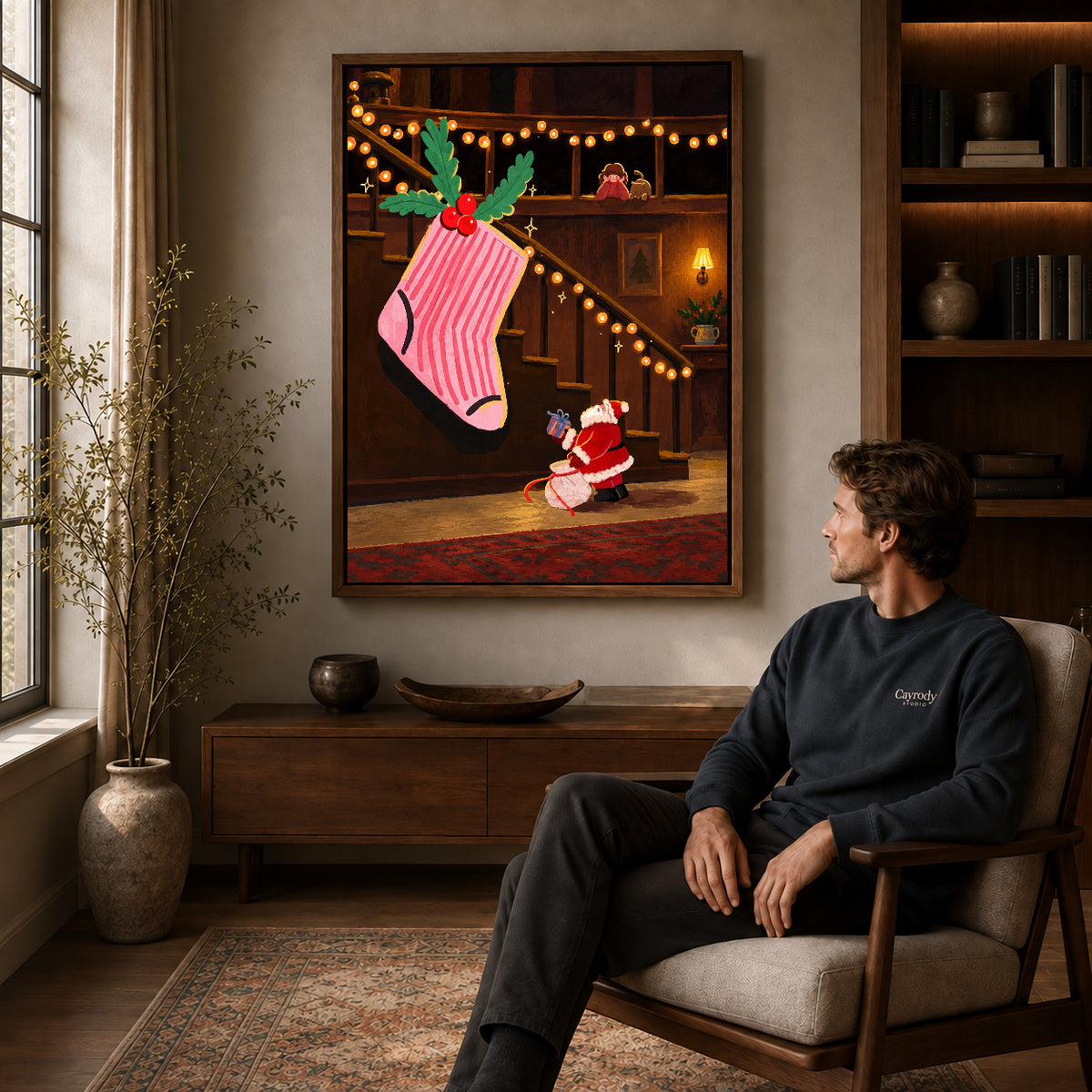 Walnut framed giant christmas stocking artwork above a seated man in a wood furnished living room.