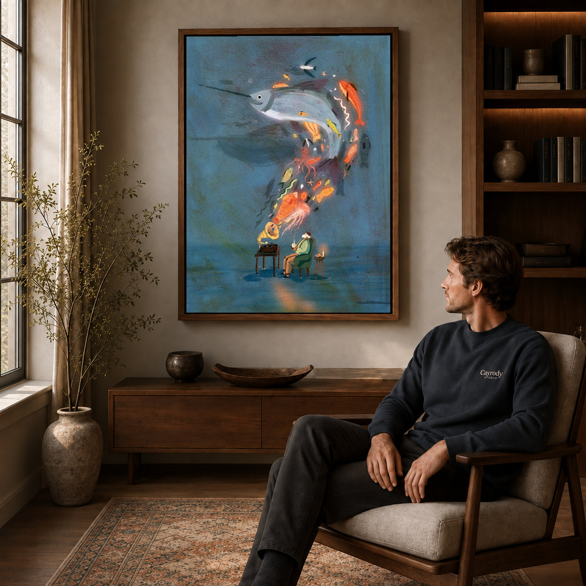 Walnut framed ocean music dream canvas art displayed above a seated man in a wood furnished room.