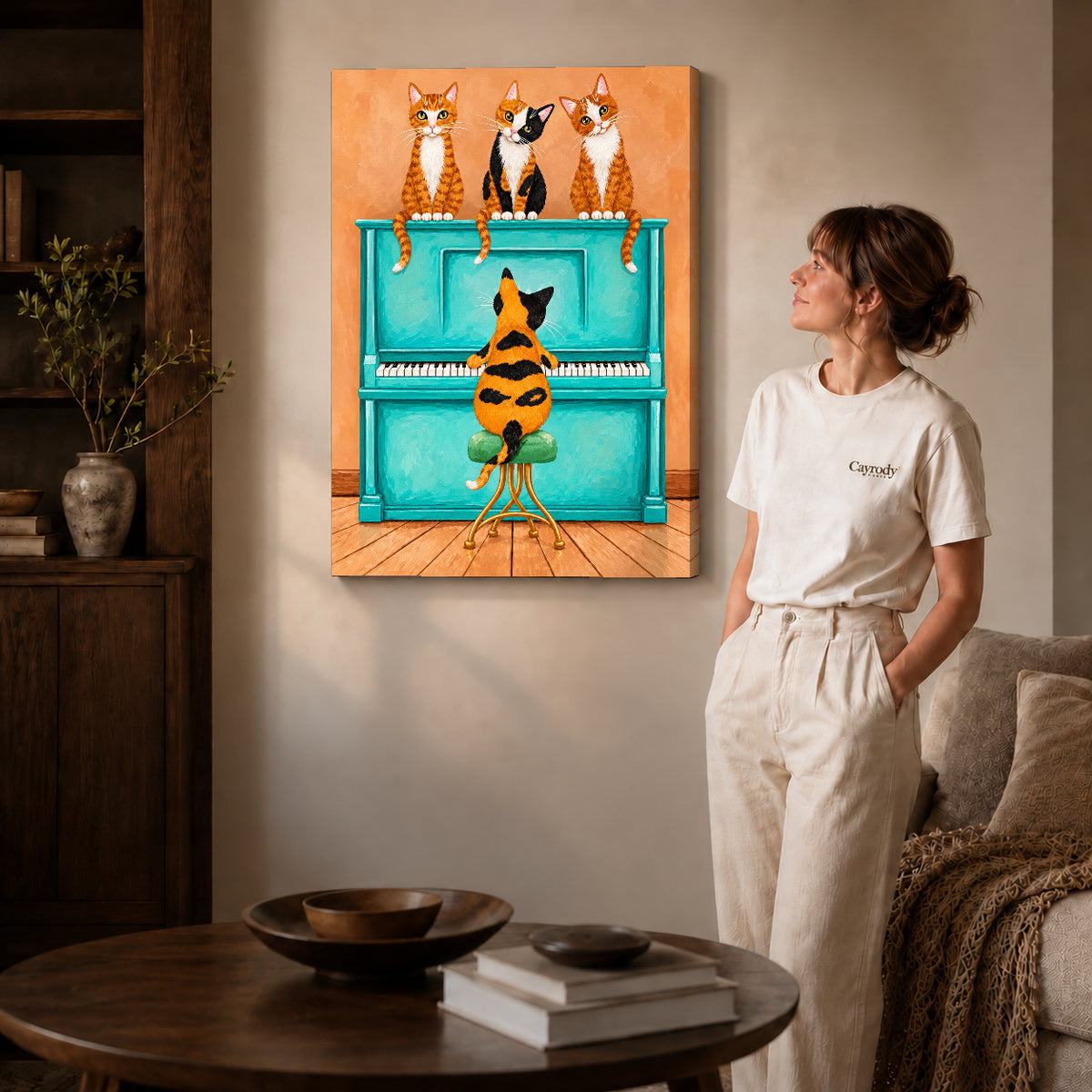 Gallery wrapped cat piano quartet canvas art with naturally shaded canvas edges beside a woman wearing cream clothing.