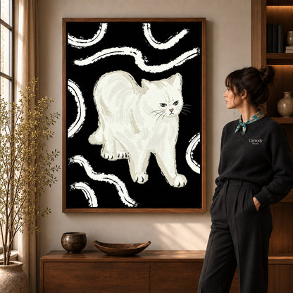 Grumpy White Cat artwork in a walnut frame beside a standing woman in a warm room.