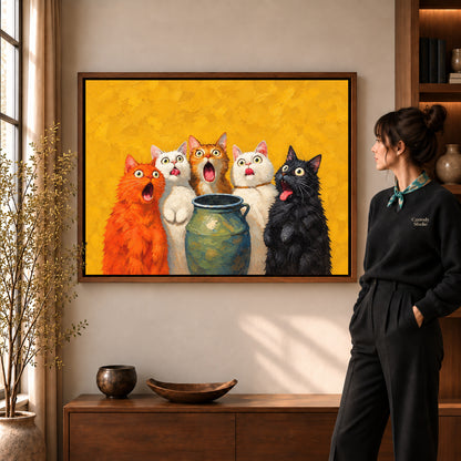 Surprised Cat Quintet artwork in a walnut frame beside a standing woman in a warm room.