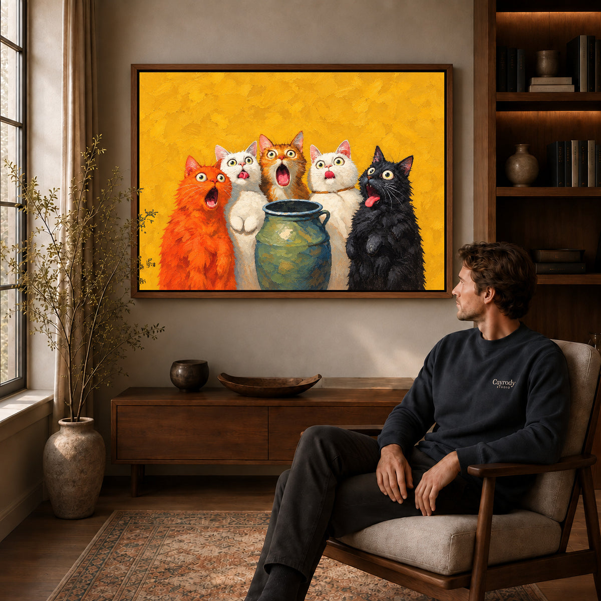 Walnut framed surprised cat quintet artwork above a seated man in a wood furnished living room.
