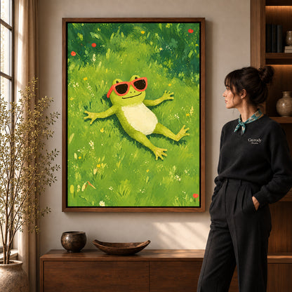 Relaxed sunny frog canvas art in a walnut frame beside a standing woman in a warm living room.