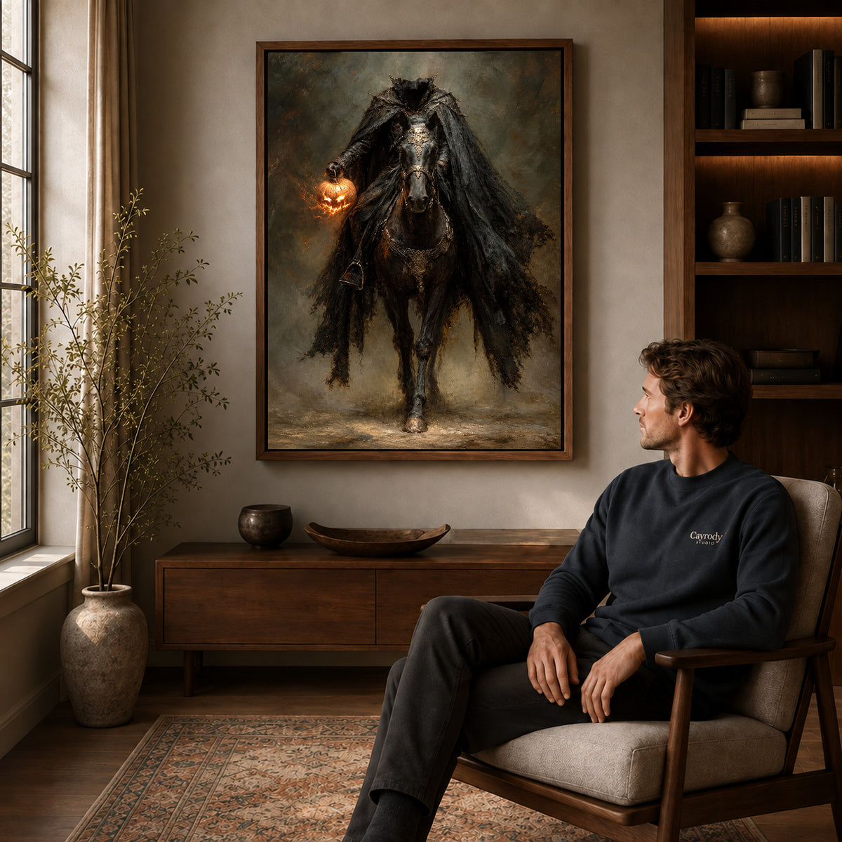 Walnut framed headless pumpkin rider artwork above a seated man in a wood furnished living room.