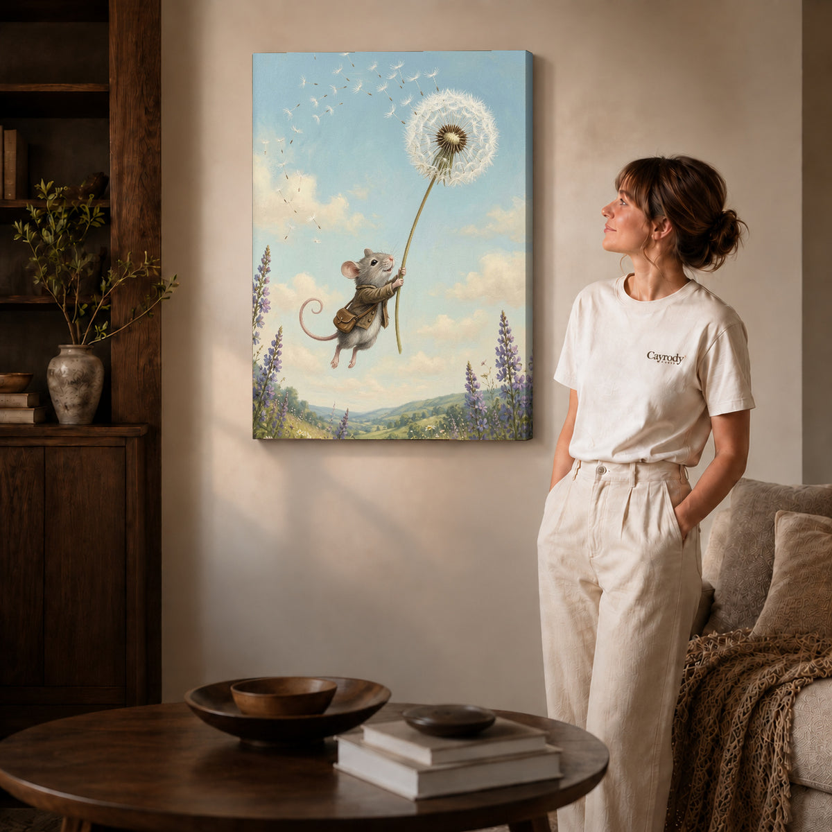 Gallery wrapped dandelion mouse ride canvas art with naturally shaded canvas edges beside a woman wearing cream clothing.