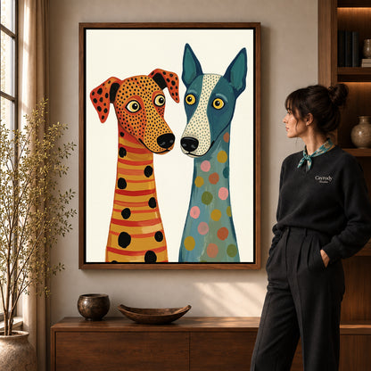Patterned dog duo canvas art in a walnut frame beside a standing woman in a warm living room.