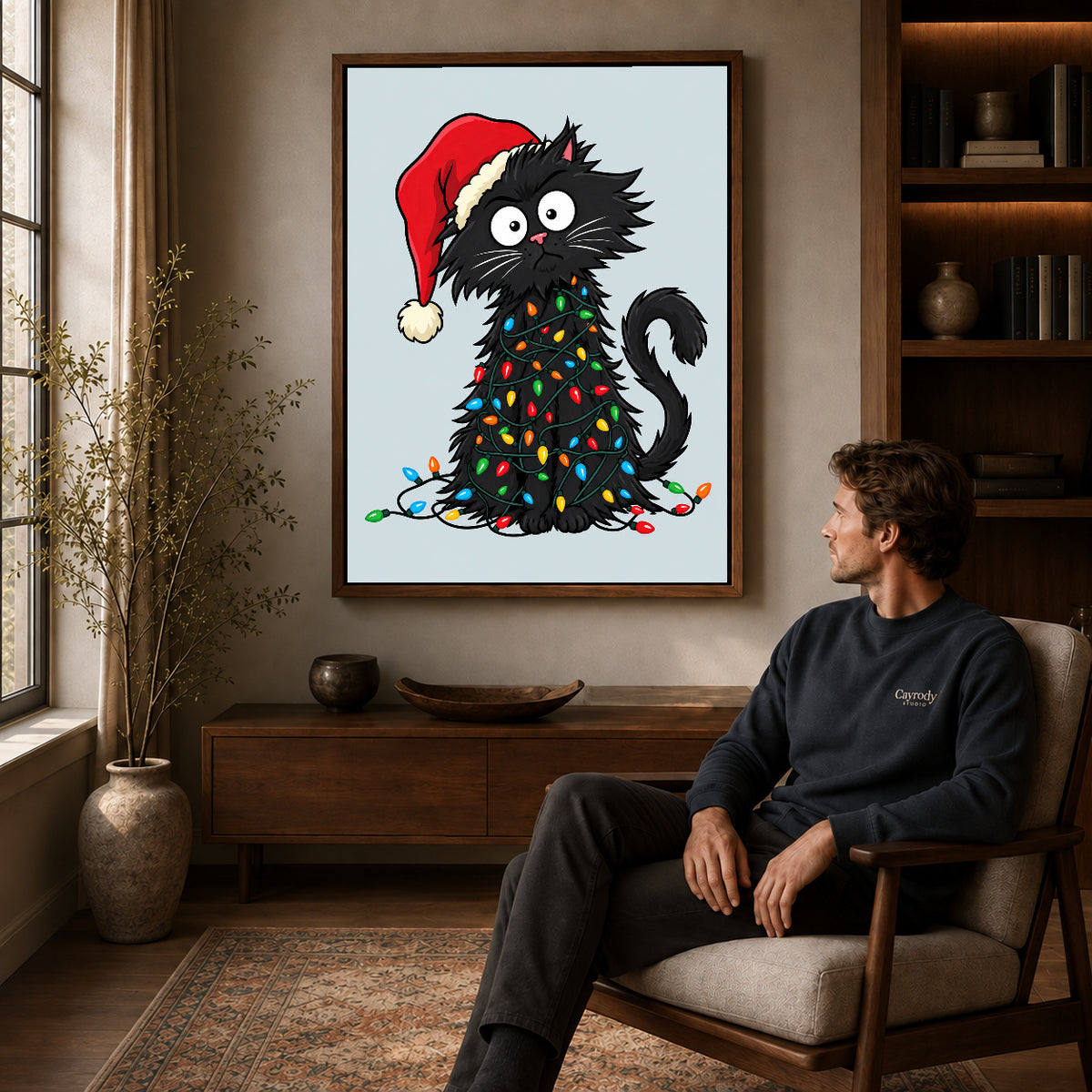 Walnut framed holiday lights cat canvas art displayed above a seated man in a wood furnished room.