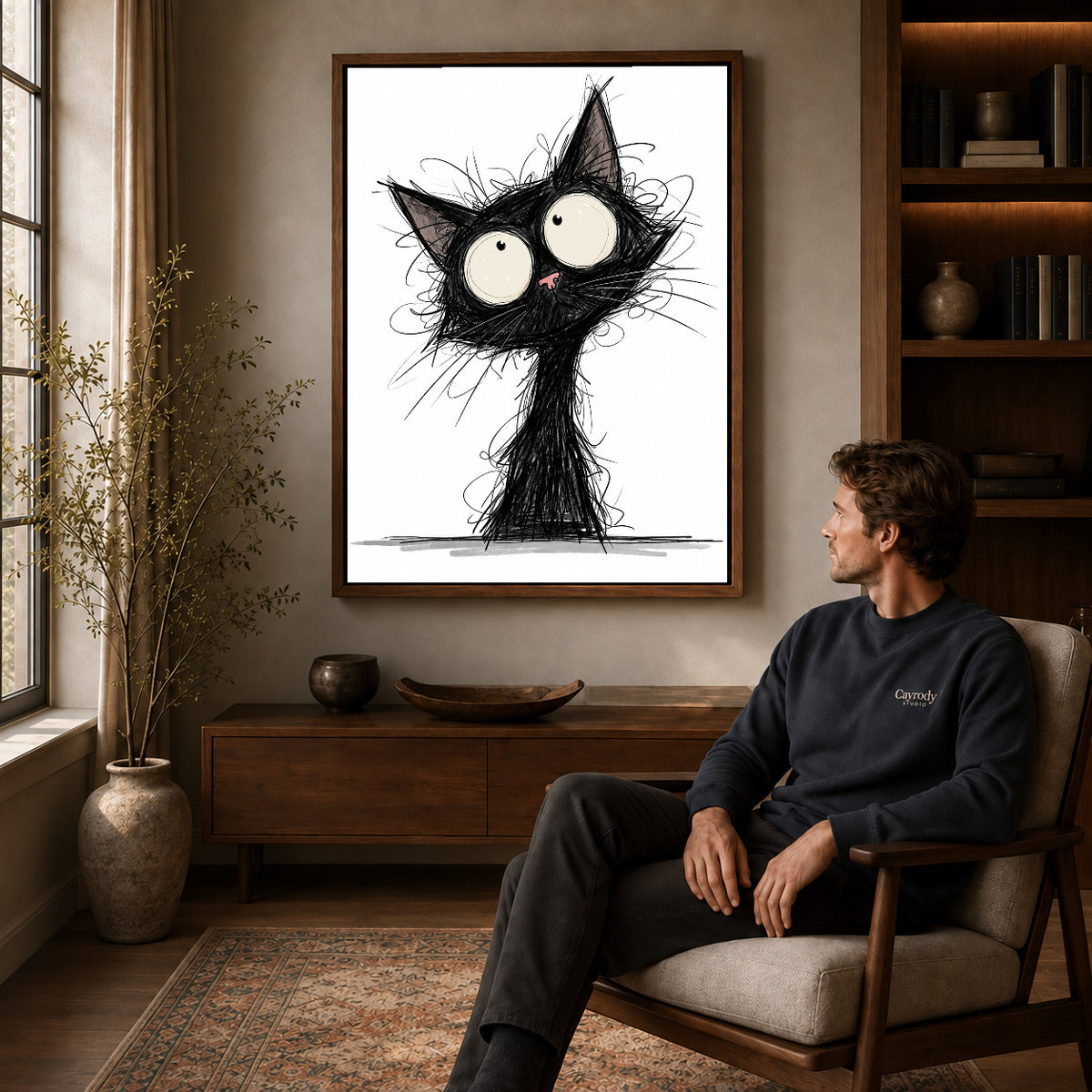 Walnut framed wide eyed sketch cat artwork above a seated man in a wood furnished living room.