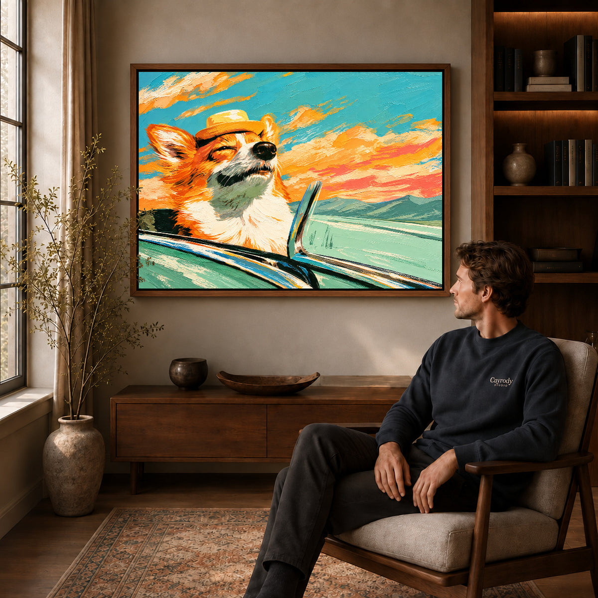 Walnut framed sunset corgi ride artwork above a seated man in a wood furnished living room.